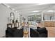 Stylish living area with exposed beam ceilings, brick walls and sleek modern decor at 5815 N 10Th Pl, Phoenix, AZ 85014