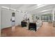 Bright living area with neutral colors, white beamed ceilings, and sliding doors to outdoors at 5815 N 10Th Pl, Phoenix, AZ 85014