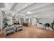 Expansive living space features exposed beams, an open layout, and contemporary decor at 5815 N 10Th Pl, Phoenix, AZ 85014