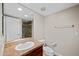 This bathroom features a single sink vanity, a large mirror, and access to the tiled shower at 625 S Roosevelt St, Tempe, AZ 85281