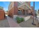 Charming brick townhome with covered front porch and attractive landscaping at 625 S Roosevelt St, Tempe, AZ 85281