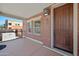 Cozy covered porch with exterior brick details and a wooden front door at 625 S Roosevelt St, Tempe, AZ 85281