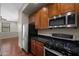 Modern kitchen area featuring stainless steel appliances and beautiful wooden cabinetry at 625 S Roosevelt St, Tempe, AZ 85281