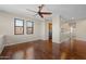 Spacious living room featuring hardwood flooring, a ceiling fan, and natural light at 625 S Roosevelt St, Tempe, AZ 85281