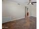 Spacious living area featuring tile flooring and ceiling fan, perfect for entertaining or relaxing at 625 S Roosevelt St, Tempe, AZ 85281