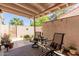 Back patio with outdoor seating on a patterned rug at 6350 N 78Th St # 280, Scottsdale, AZ 85250