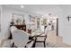 Dining room with glass table and white chairs, next to the kitchen at 6350 N 78Th St # 280, Scottsdale, AZ 85250