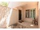 Welcoming front entryway with neutral stucco, a window with shutters, and an inviting doormat at 6350 N 78Th St # 280, Scottsdale, AZ 85250