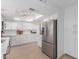Bright white kitchen with modern appliances, stone countertops and recessed lighting at 6350 N 78Th St # 280, Scottsdale, AZ 85250