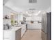 Bright white kitchen featuring stainless steel appliances, stone countertops, and a garden window at 6350 N 78Th St # 280, Scottsdale, AZ 85250
