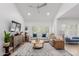 Comfortable living room with vaulted ceilings, white walls, hardwood floors, and a ceiling fan at 6350 N 78Th St # 280, Scottsdale, AZ 85250