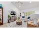 Bright living room with vaulted ceilings, white walls, hardwood floors, and plantation shutters at 6350 N 78Th St # 280, Scottsdale, AZ 85250