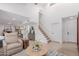 Bright living room with high ceilings, white walls, hardwood floors, and a staircase at 6350 N 78Th St # 280, Scottsdale, AZ 85250