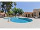 Relaxing community pool with tables, chairs, umbrellas, and poolside lounging for residents enjoyment at 6350 N 78Th St # 280, Scottsdale, AZ 85250