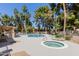 Community pool and hot tub surrounded by lush landscaping and mature trees for a resort-like experience at 6350 N 78Th St # 280, Scottsdale, AZ 85250