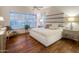 Bright bedroom with hardwood floors, modern furnishings, and ample natural light at 6767 E Nightingale Star Cir, Scottsdale, AZ 85266