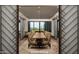 Elegant private dining room featuring a large wood table and comfortable seating with a view at 6767 E Nightingale Star Cir, Scottsdale, AZ 85266