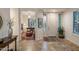 Inviting entryway with view to office space, features tile flooring, and natural light at 6767 E Nightingale Star Cir, Scottsdale, AZ 85266