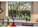 Bright kitchen featuring a marble countertop, stainless steel faucet, and a large window view at 6767 E Nightingale Star Cir, Scottsdale, AZ 85266
