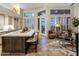 Open-concept kitchen featuring a large island with seating and a seamless transition to the living area at 6767 E Nightingale Star Cir, Scottsdale, AZ 85266