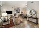 Open-concept layout showcasing the living room's stylish furnishings and seamless flow to dining area at 6767 E Nightingale Star Cir, Scottsdale, AZ 85266