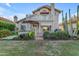 Charming home featuring a backyard with covered patio, balcony, and lush desert landscaping at 6841 S Roosevelt St, Tempe, AZ 85283