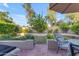 Private backyard with lush green grass and a relaxing patio setting at 6841 S Roosevelt St, Tempe, AZ 85283