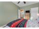 Bedroom with neutral paint, a ceiling fan, and furniture at 6841 S Roosevelt St, Tempe, AZ 85283