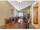 Charming dining room with a rustic table, leather chairs, and a view into the living area at 6841 S Roosevelt St, Tempe, AZ 85283