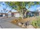 Charming two-story home with a tile roof, attached garage, and a desert-landscaped front yard with rock and cactus at 6841 S Roosevelt St, Tempe, AZ 85283