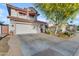 Charming two-story home with a tile roof, attached garage, and a desert-landscaped front yard and driveway at 6841 S Roosevelt St, Tempe, AZ 85283