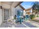 Charming front porch with chairs and potted plants at 6841 S Roosevelt St, Tempe, AZ 85283