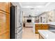 Updated kitchen offering stainless steel appliances and open layout to the living area at 6841 S Roosevelt St, Tempe, AZ 85283