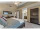 Spacious main bedroom features vaulted ceiling, hardwood floor, ensuite bathroom, and a large rug at 6841 S Roosevelt St, Tempe, AZ 85283