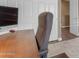 Close up of office desk and chair with door to the hallway visible at 6841 S Roosevelt St, Tempe, AZ 85283