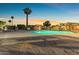 Community pool featuring lounge furniture and tranquil ambiance perfect for evening swims and relaxation at 6841 S Roosevelt St, Tempe, AZ 85283