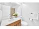 Bathroom with a wood vanity, white countertop, and a mirrored wall cabinet at 7114 W Yucca St, Peoria, AZ 85345