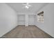 Bedroom with neutral carpet, ceiling fan, a window, and built in closet at 7114 W Yucca St, Peoria, AZ 85345