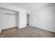 Bedroom featuring neutral carpet, ceiling fan, a window, and walk in closet at 7114 W Yucca St, Peoria, AZ 85345