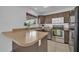 Bright kitchen with stainless steel appliances, neutral countertops, and ample cabinet space at 7114 W Yucca St, Peoria, AZ 85345