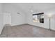 Cozy living room featuring neutral tile flooring, a ceiling fan, large window and a closet at 7114 W Yucca St, Peoria, AZ 85345