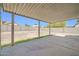 View from the covered patio showcasing its concrete flooring and view of the large backyard at 7114 W Yucca St, Peoria, AZ 85345