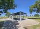 Park pavilion with picnic tables offering a shady spot for gatherings and relaxation outdoors at 7114 W Yucca St, Peoria, AZ 85345