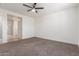 Spacious bedroom with ceiling fan and neutral carpet at 716 W Blue Ridge Dr, San Tan Valley, AZ 85140