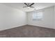 Bedroom with neutral carpet, a ceiling fan, and a window with horizontal blinds at 716 W Blue Ridge Dr, San Tan Valley, AZ 85140