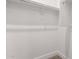 Walk-in closet with white walls, providing ample storage space for an organized wardrobe at 716 W Blue Ridge Dr, San Tan Valley, AZ 85140
