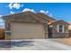 A two car garage with a large driveway at 716 W Blue Ridge Dr, San Tan Valley, AZ 85140