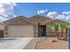 Charming single story home with a two car garage, desert landscaping, and a tile roof at 716 W Blue Ridge Dr, San Tan Valley, AZ 85140
