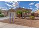 Well-maintained front exterior features desert landscaping and a two car garage at 716 W Blue Ridge Dr, San Tan Valley, AZ 85140