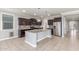 Spacious kitchen with stainless steel appliances, granite countertops, and an island with a sink at 716 W Blue Ridge Dr, San Tan Valley, AZ 85140
